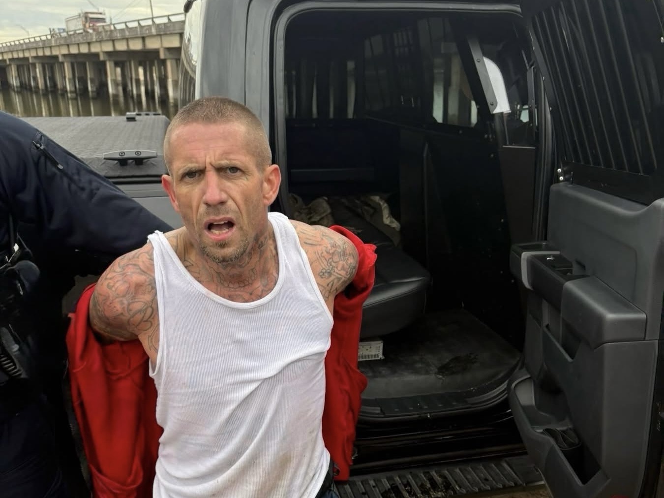 Fugitive arrested near Hitchcock, after land and water chase